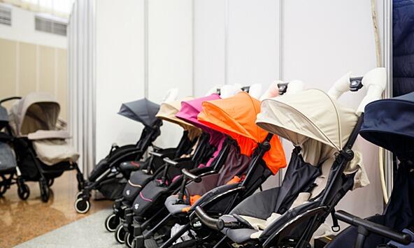 row of colourful prams in a shop